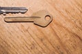 Pair of keys isolated on a wooden background. safety and security concept
