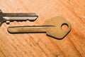 Pair of keys isolated on a wooden background. safety and security concept