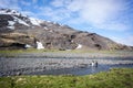 Pair of King Penguins in scenic background of Salisbury plain