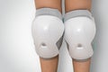 Pair of knee pads wearing on legs of child