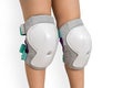 Pair of knee pads wearing on legs of child