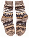 Pair of Knitted Wool Socks with Geometric Patterns in Earth Tones Royalty Free Stock Photo