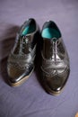 Pair of ladies black leaher wingtip shoes