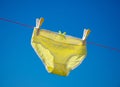 Yellow Panties, knickers drying on the washing line. Royalty Free Stock Photo