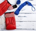 Pair of leather red boxing gloves and blue bandage Royalty Free Stock Photo