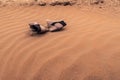 Pair of lost women shoes on the sand in the dunes Royalty Free Stock Photo