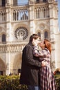 A pair of lovers on the background of Notre Dame de Paris