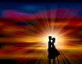 A pair of lovers kissed in the sunset. Royalty Free Stock Photo