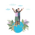 A pair of lovers with their hands raised. Standing on the planet earth, a symbol of victory and peace. Interracial relations and