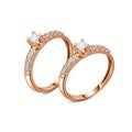 A pair of luxury rose gold rings with diamonds isolated
