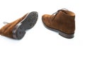 Pair of Male Brown Suede Chukka Boots Placed Randomly Together On White Background Royalty Free Stock Photo