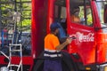 A pair of male employees make a delivery of Coca Cola to a local supermarket in Playa Las Americas in the canary island of Tenerif