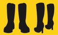 A pair of male and female boots silhouette against a yellow backdrop Royalty Free Stock Photo