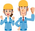 Pair of male and female working on construction site blue work clothes