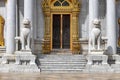 Pair of marble lions in front of the door of Wat Benchamabophit Dusit Wanaram