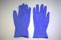 Pair of medical examination gloves on white