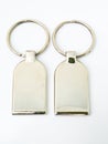 A pair of metalic trinket keychain isolated on white background Royalty Free Stock Photo