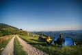 A pair of motorcyclists enjoy the view, man and woman. Loving couple of tourists. Relationship and adventure concept. A touring