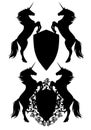 Two unicorns holding black vector heraldic shield Royalty Free Stock Photo