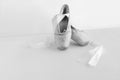 pair of neatly arranged ballet shoes. white background with copyspace, pointe shoes black and white Royalty Free Stock Photo