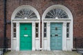 A pair of neighboring Georgian style front doors