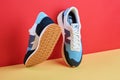 Pair of New Balance shoes model MS237HL1 on creative colorful background