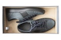 A pair of new blue man shoes in a shoe box isolated oh white Royalty Free Stock Photo