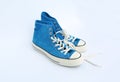 Pair of new blue sneakers isolated on white background Royalty Free Stock Photo