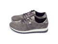 Pair of new female suede sneakers isolated