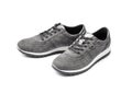 Pair of new gray female suede sneakers isolated