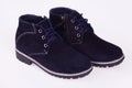 Pair of new modern dark blue suede stylish sneakers for kids on laces Royalty Free Stock Photo