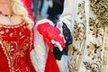 Noble Lovers Holding Hands in Ancient and Luxurious Aristocratic Clothes during Masquerade Ball