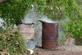 Pair of oil drums used to burn rubbish in the nature. Poor management of waste and illegal practice.