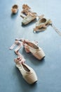 Pair of old ballet shoes on grey background. Royalty Free Stock Photo