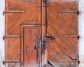 Old wooden barn doors on concrete wall Royalty Free Stock Photo