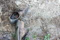 Pair of old dirty used shoes. Abandoned discarded boots laying in dust on ground. Poverty or beggary concept. Copyspace Royalty Free Stock Photo