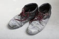 Pair of old dirty work boots in building site Royalty Free Stock Photo