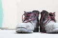 Pair of old dirty work boots in building site Royalty Free Stock Photo