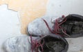 Pair of old dirty work boots in building site Royalty Free Stock Photo