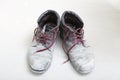 Pair of old dirty work boots in building site Royalty Free Stock Photo