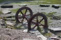 A pair of old disused metal mine train wheels