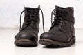 Pair of old leather black hipster boots Royalty Free Stock Photo