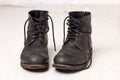 Pair of old leather black hipster boots Royalty Free Stock Photo