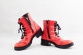 Pair of old leather red discarded boots with laces Royalty Free Stock Photo