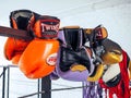 A pair of old Muay Thai boxing gloves hangs on the boxing ring in a boxing king camp Royalty Free Stock Photo