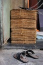 A pair of old slippers close to old newspapers, Fort, Mumbai Royalty Free Stock Photo