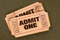 Pair of old torn admit one movie tickets