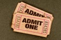 Pair of old torn admit one movie tickets