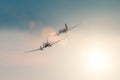 A pair of old turboprop aircraft in the sky at sunset. Royalty Free Stock Photo