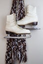 Pair of old white ice skates hanging Royalty Free Stock Photo